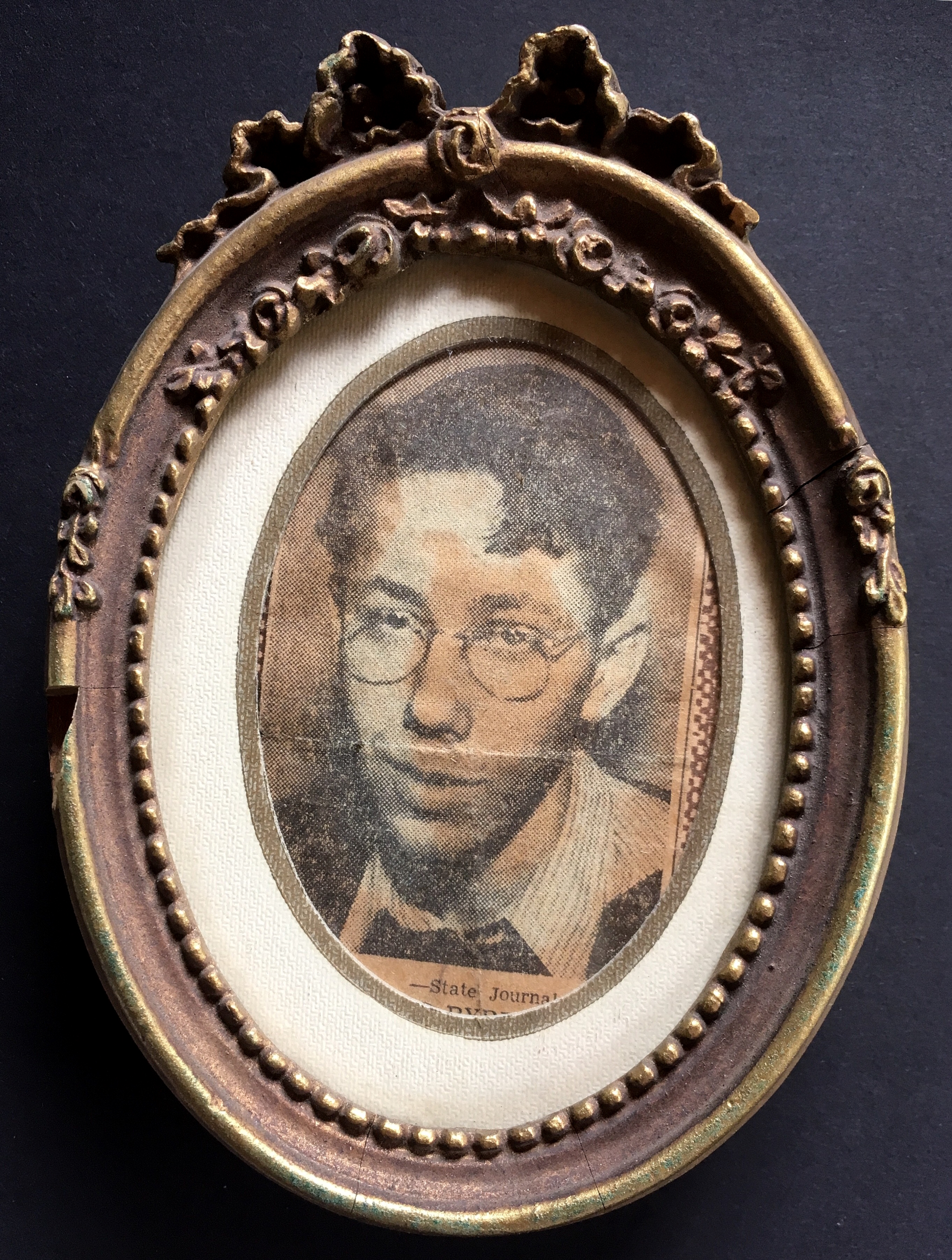 A framed photo of young David Byrd that was cut out of a newspaper, possibly related to a drawing contest.&nbsp;