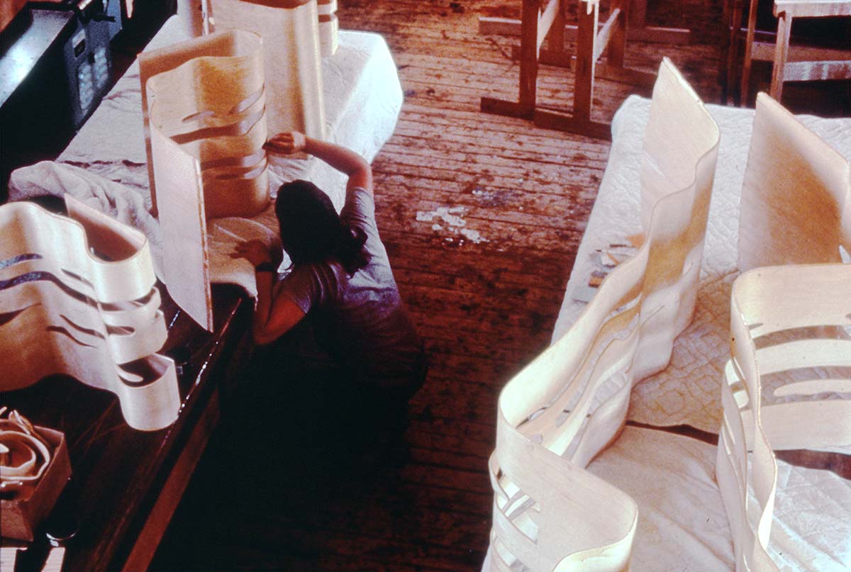 Jesse Metcalf of Beeken Parsons working on laminations for RLCR 3593, Brushstroke Chair and Brushstroke Ottoman in 1987. Photo: Bruce Beeken/Graphicstudio, courtesy Graphicstudio Photo Archives