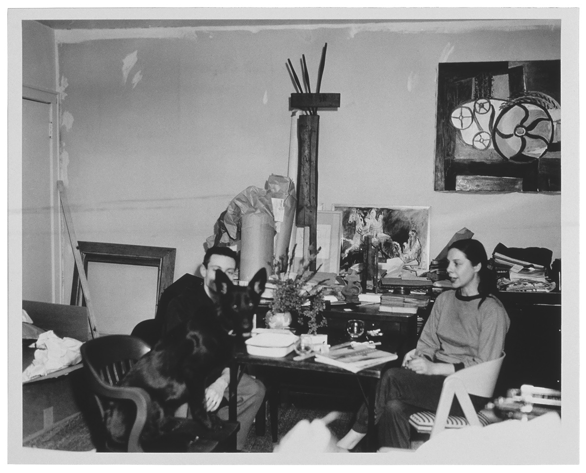 Roy and Isabel Lichtenstein with their dog, Woofy, in Cleveland, Ohio, c. 1954, in front of RLCR 197, RLCR 262, and RLCR 449. Photo: Photographer unknown, courtesy RLF Archives; artwork © Estate of Roy Lichtenstein